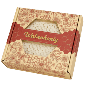 Wabenhonig in dekorativer Verpackung mit sichtbarer Honigwabe